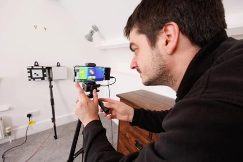 Test engineer carrying out a Heat3D U-value measurement