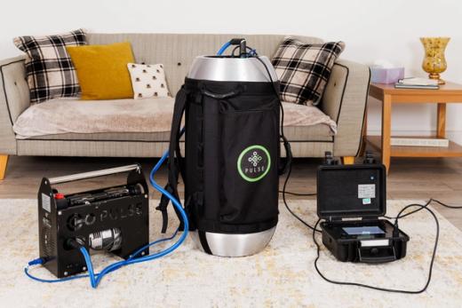 Pulse airtightness testing equipment set up in a home