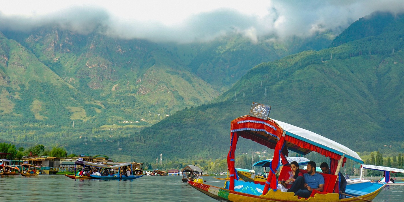 Premium Kashmir tour with travellers enjoying snow-covered Himalayan landscapes