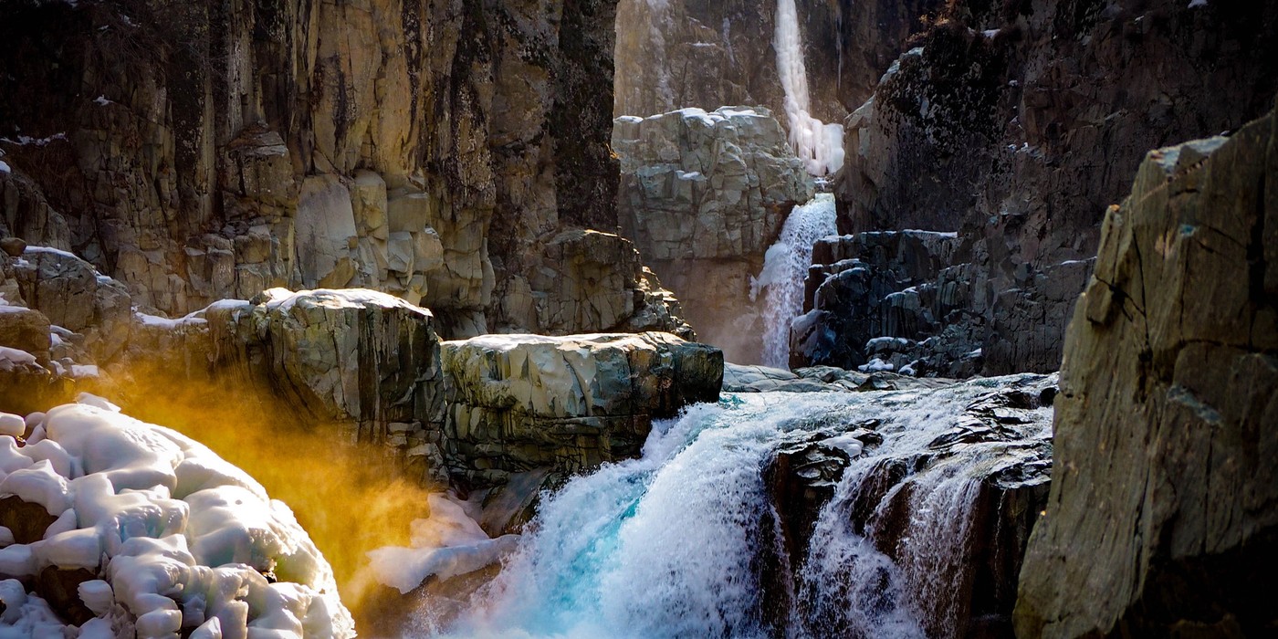 Aharbal Waterfall surrounded by forest in Kashmir