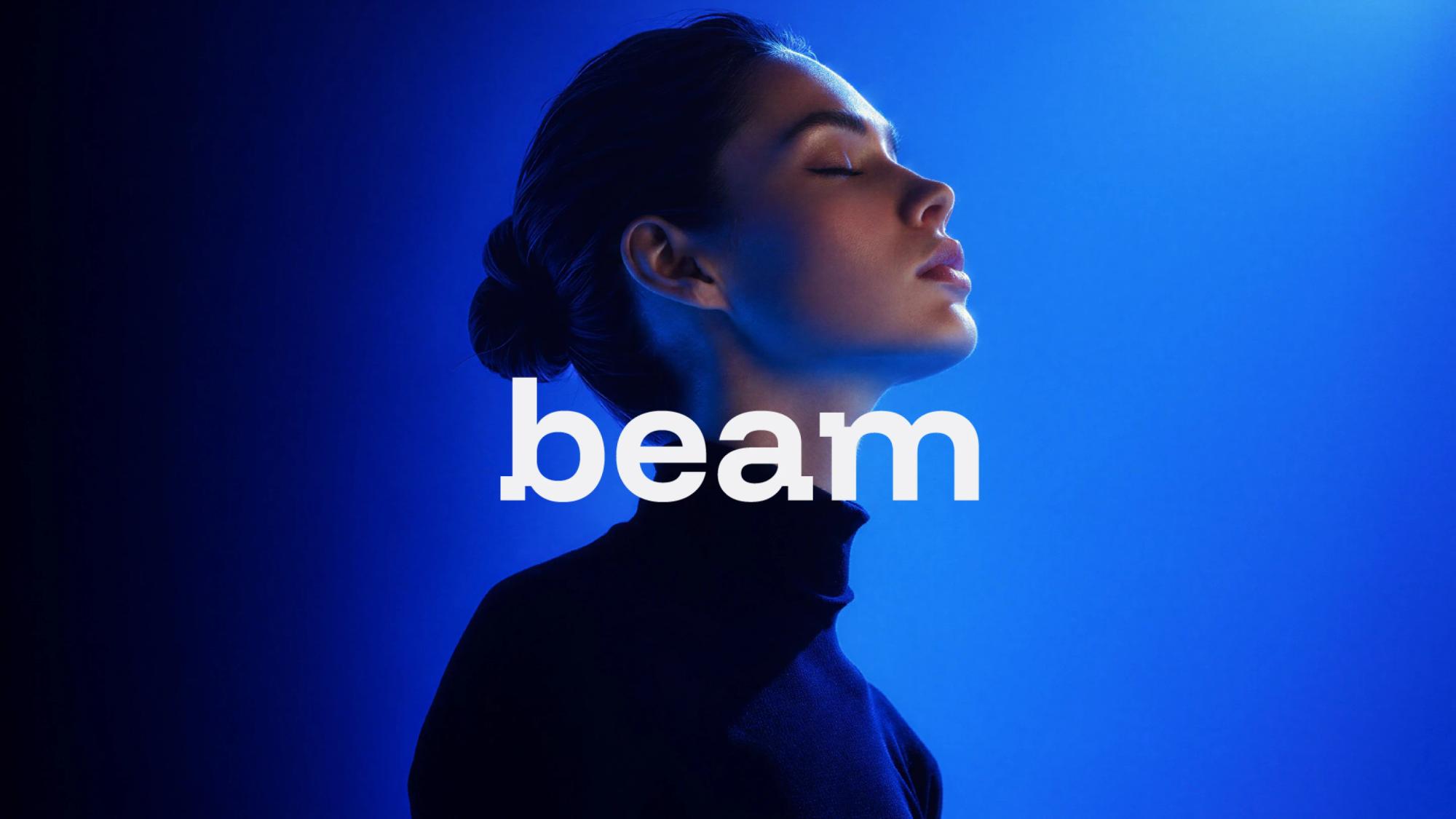 Beam wordmark over a portrait in blue light