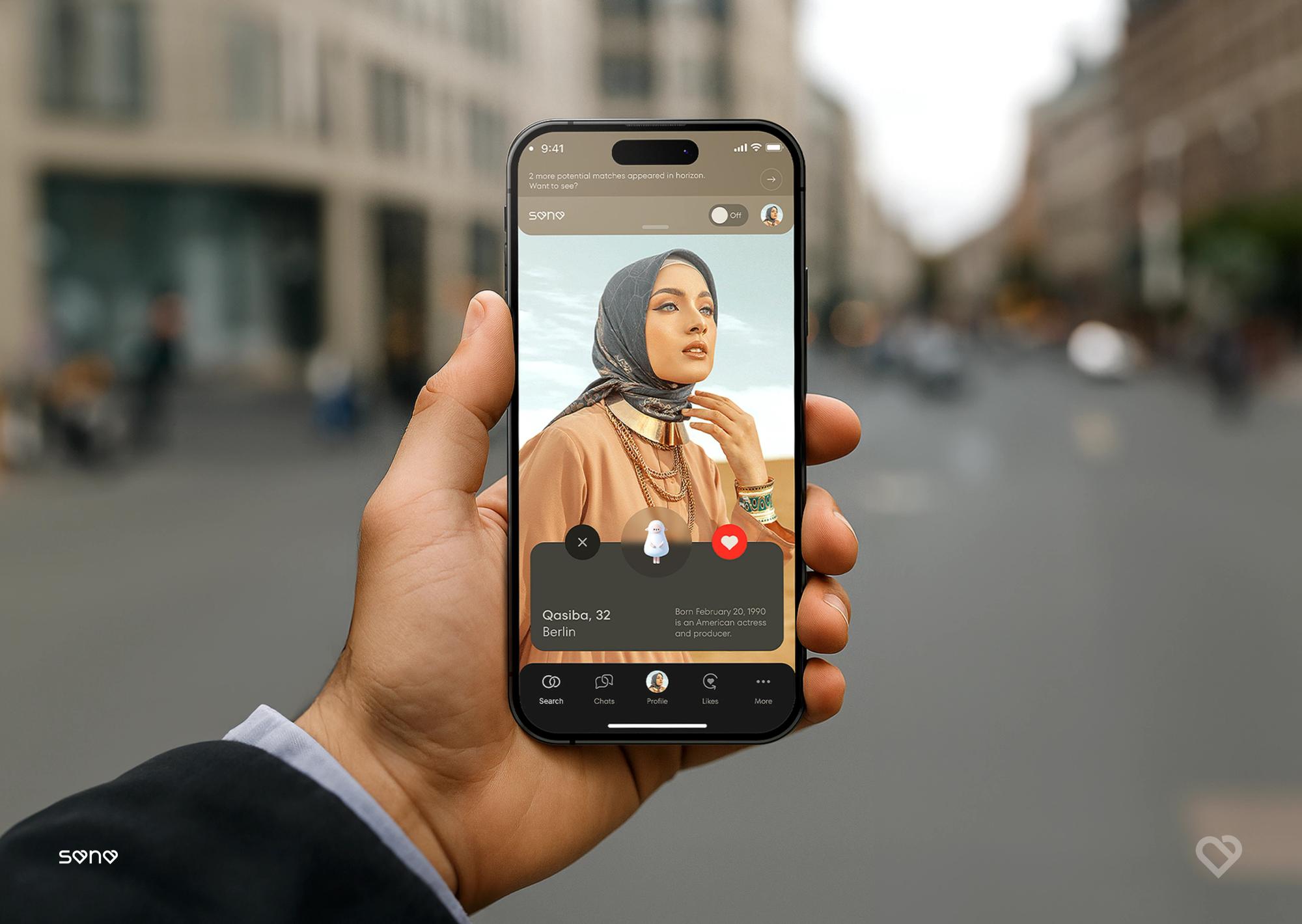 Hand holding a phone with a Sana profile card on a city street