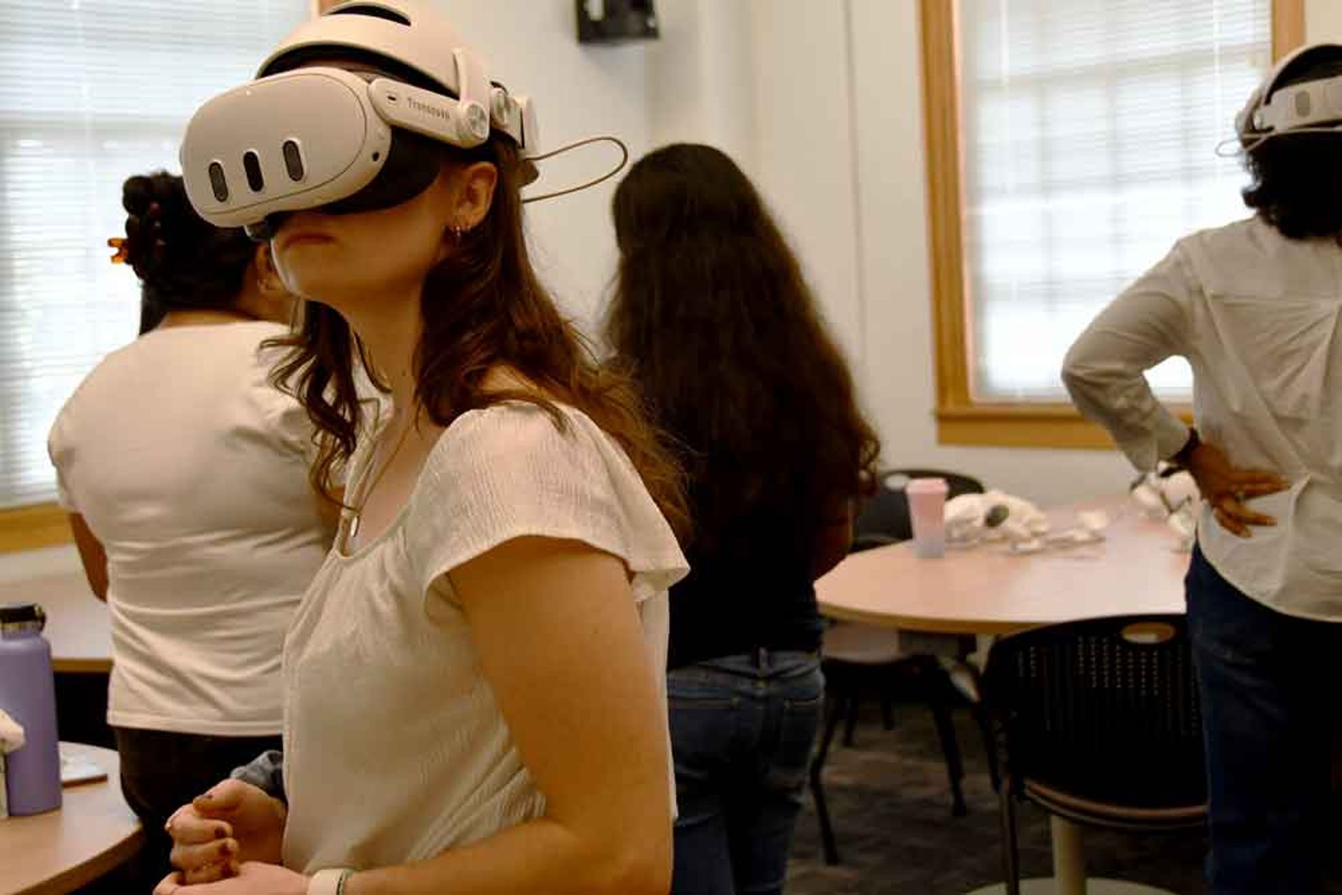 Students wear VR headsets.