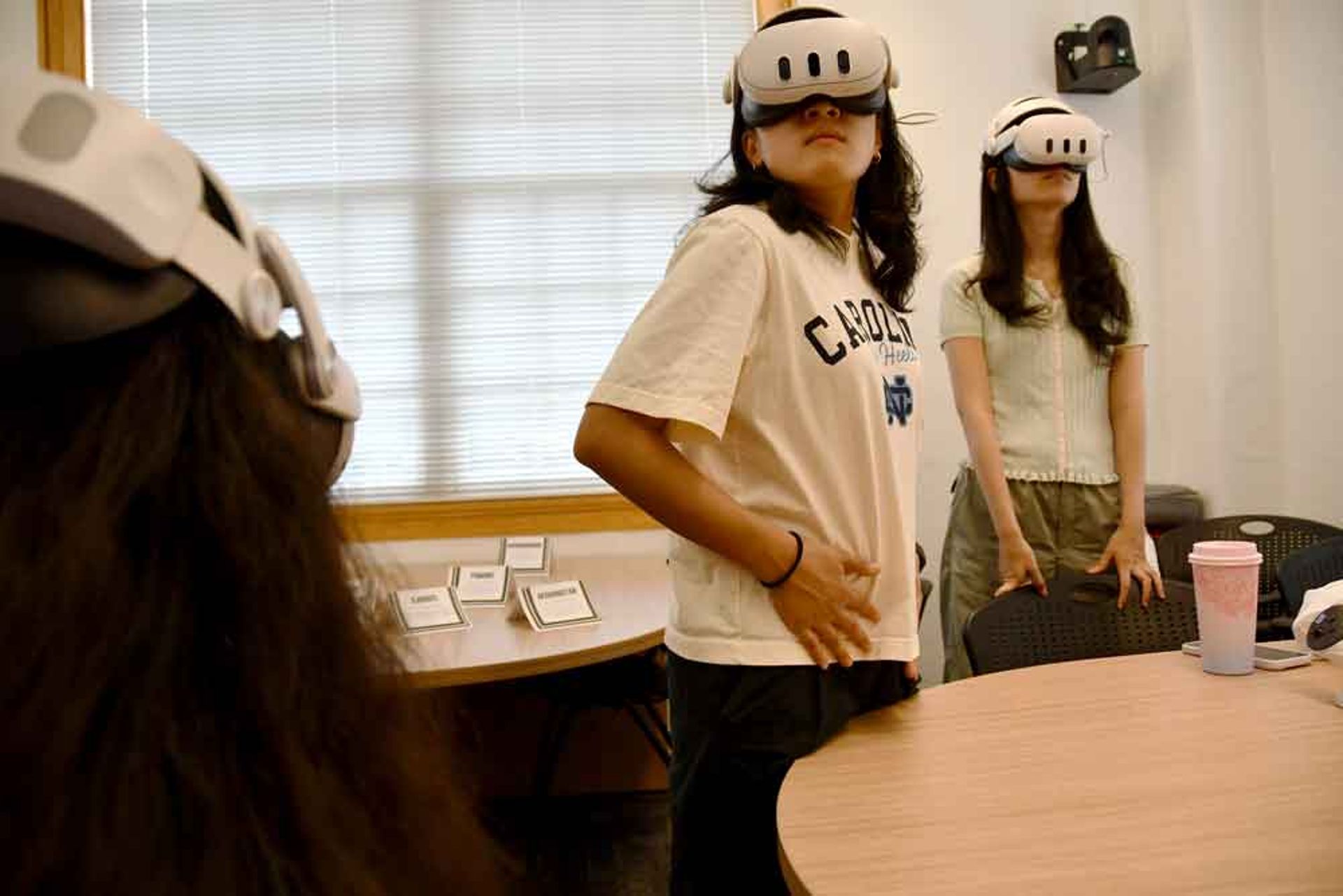 Students wear VR headsets.