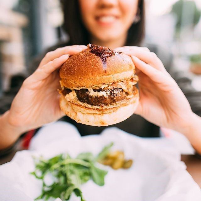 A person eating a burger