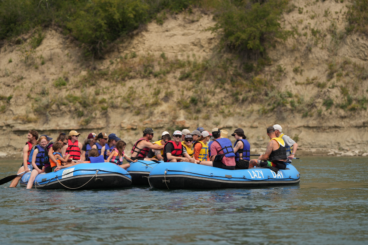 Two rafts filled with groups of people