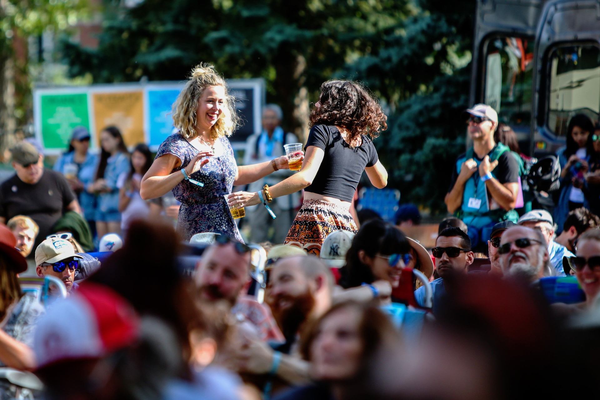 Two ladies dancing at the concert