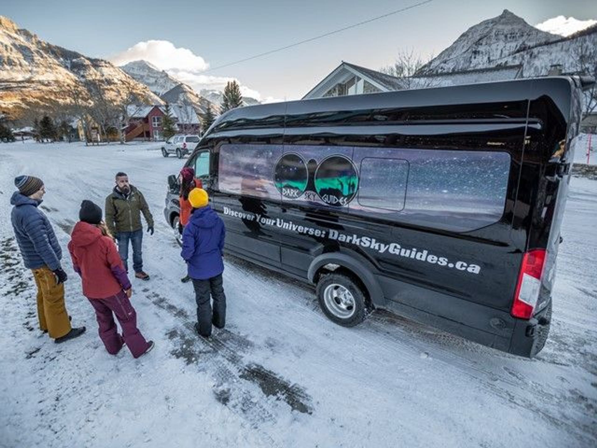 Guide and Guests during the pre-tour briefing, prior to getting on the Dark Sky Tour Bus.