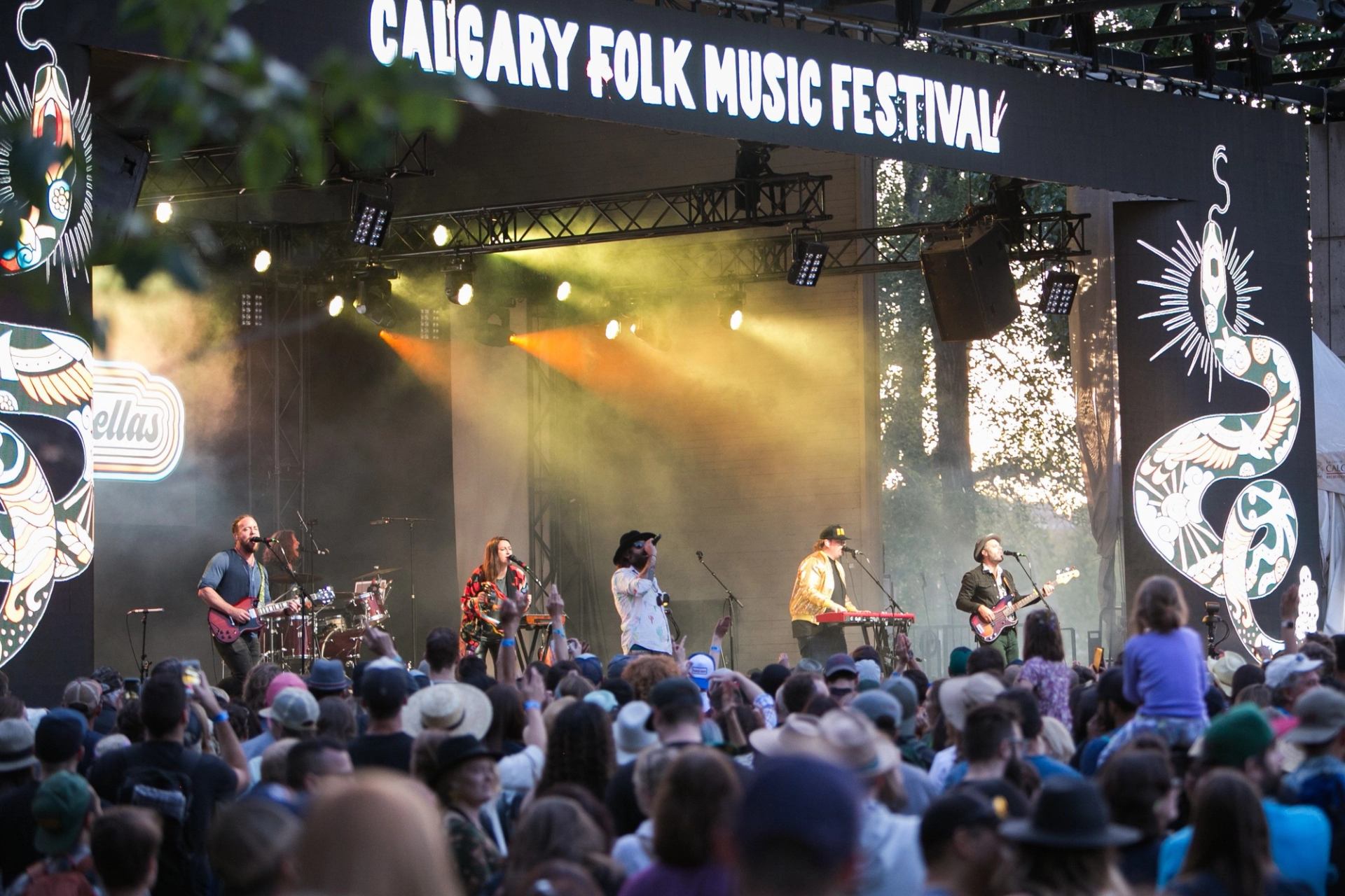 A group playing on stage as the concert goers watch
