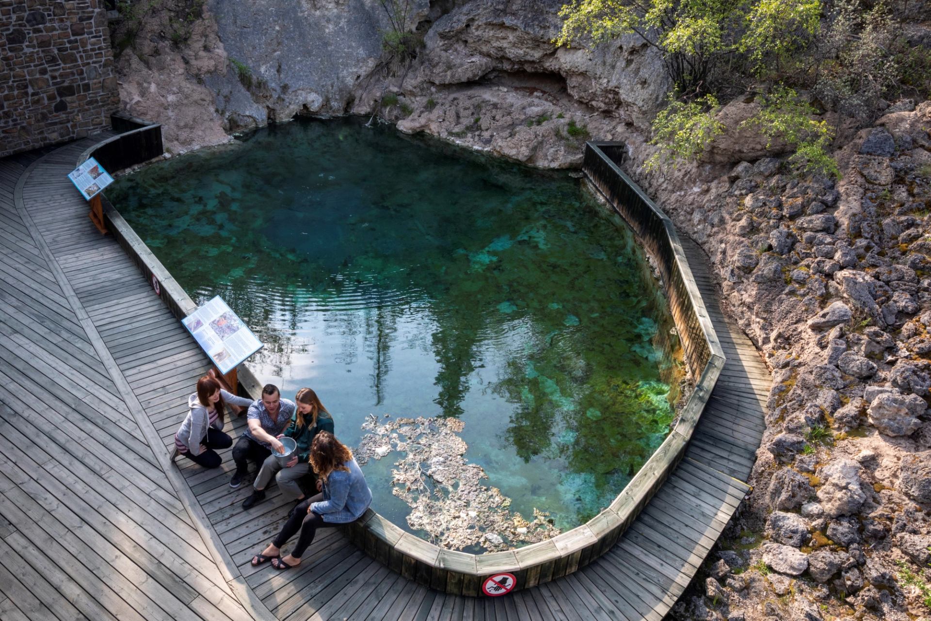 Birds eye view of vistors at the Cave and Basin National Historic Site.