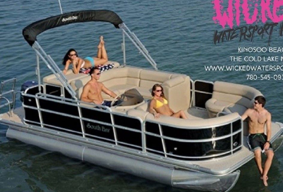 Four people lounging on a pontoon boat
