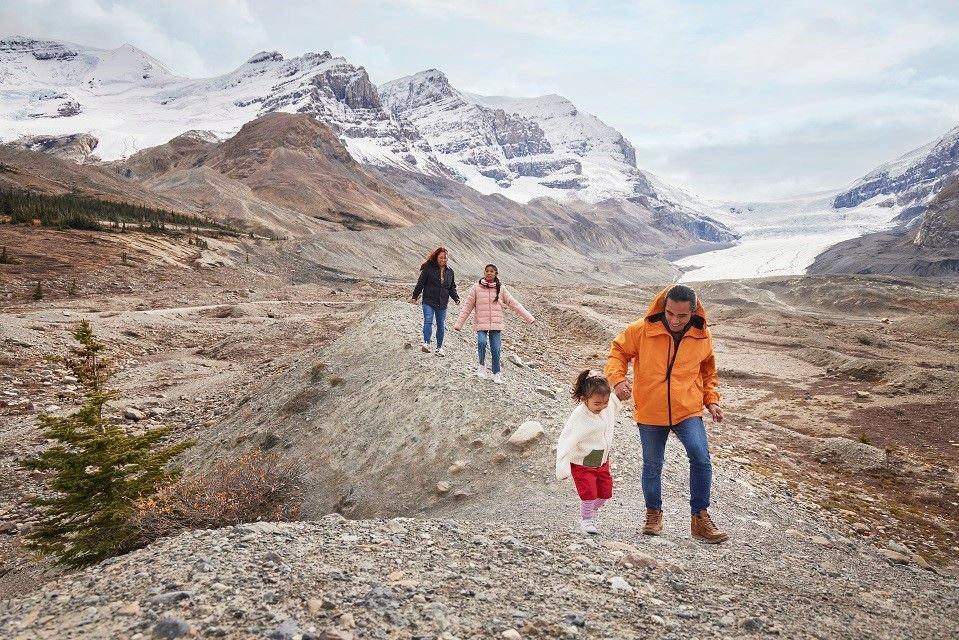 Family exploring the Columbia Ice Fields in Jasper National Park.