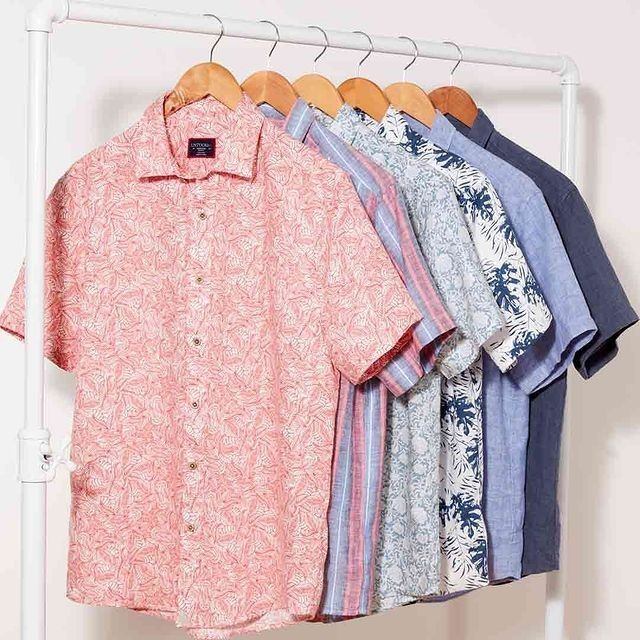 Shirts hung on hangers in a department store.