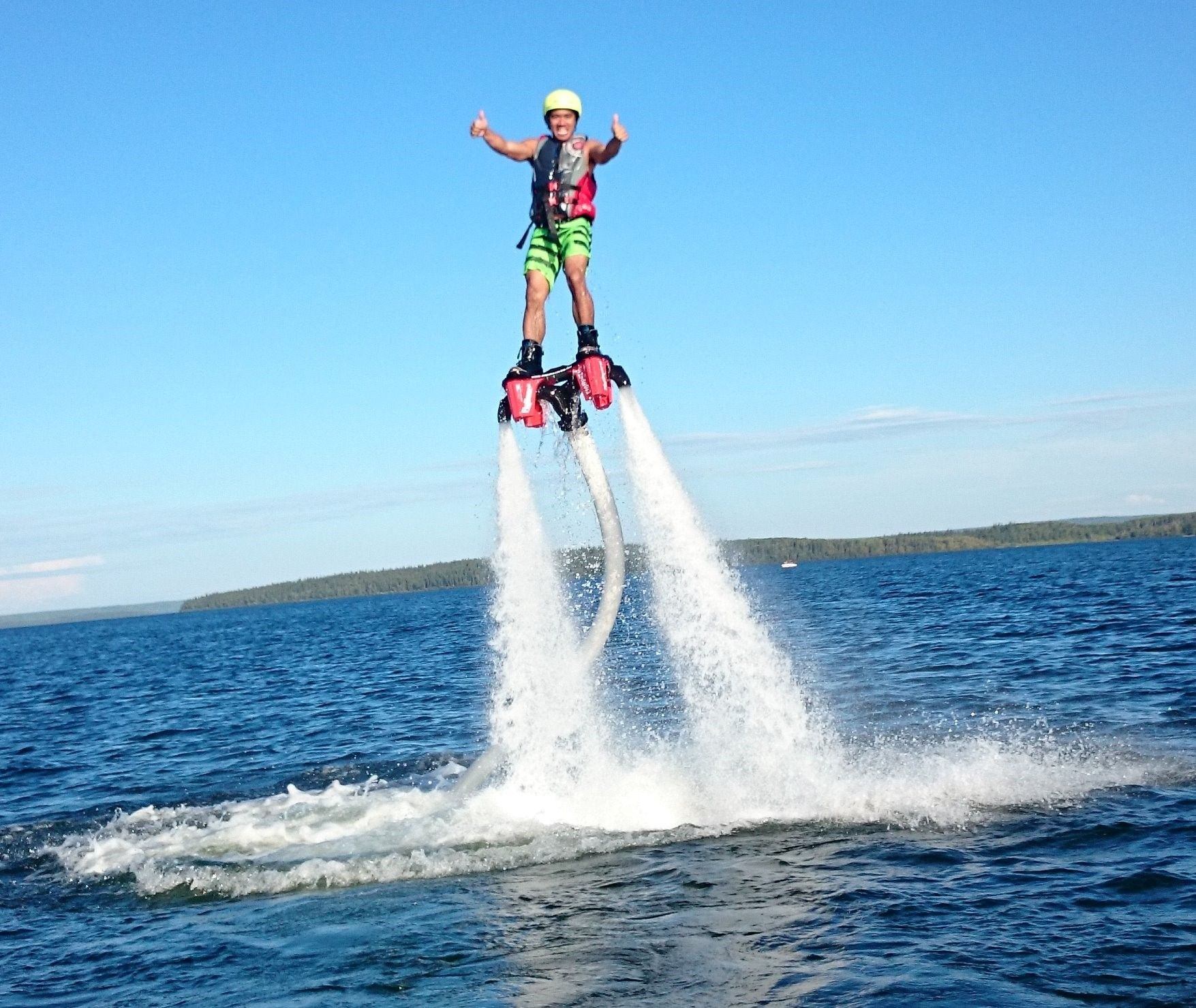 A person flyboarding on a lake
