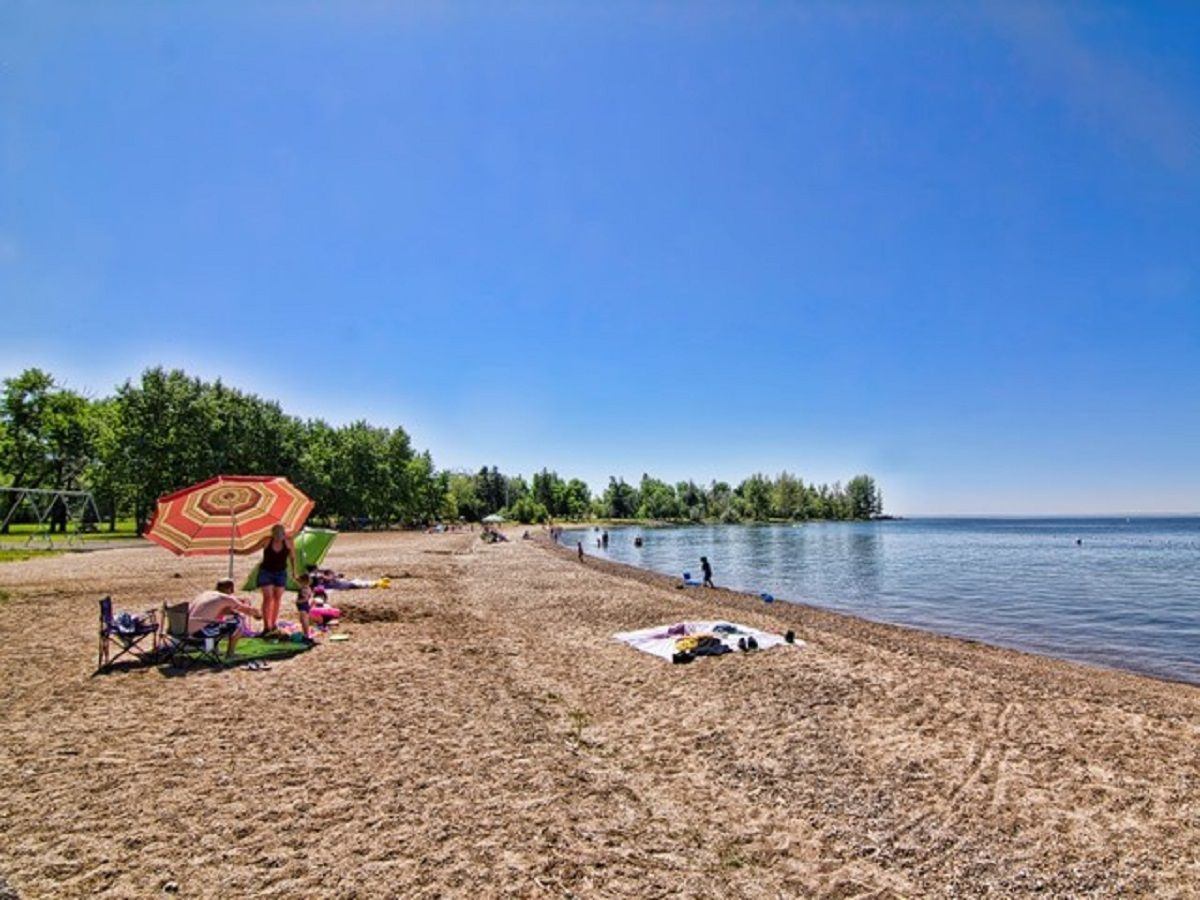 People enjoying a sunny day on the beach.