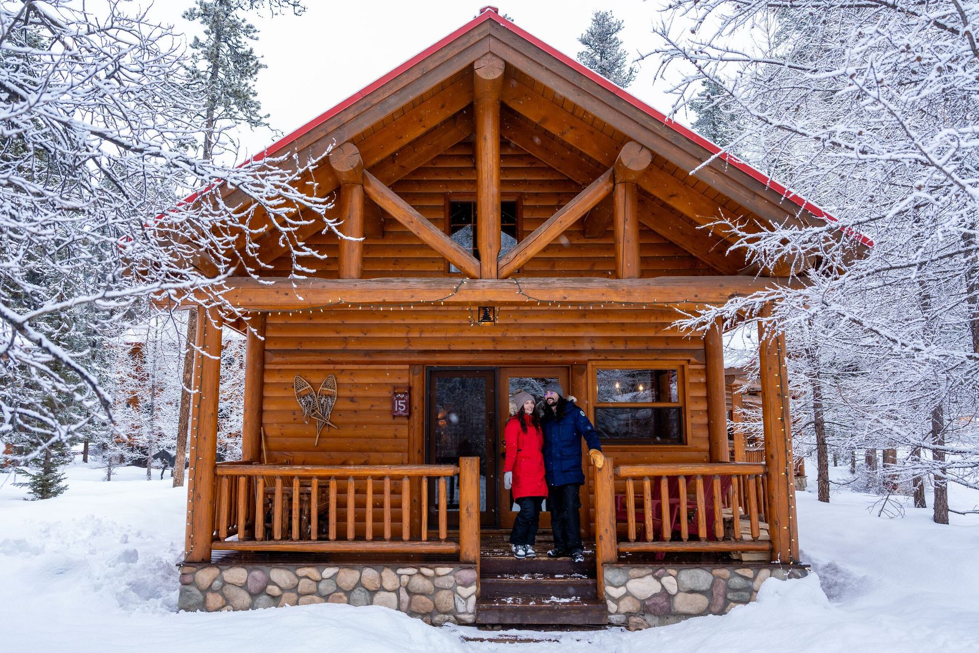 Couple on the porch of at Baker Creek Cabin.