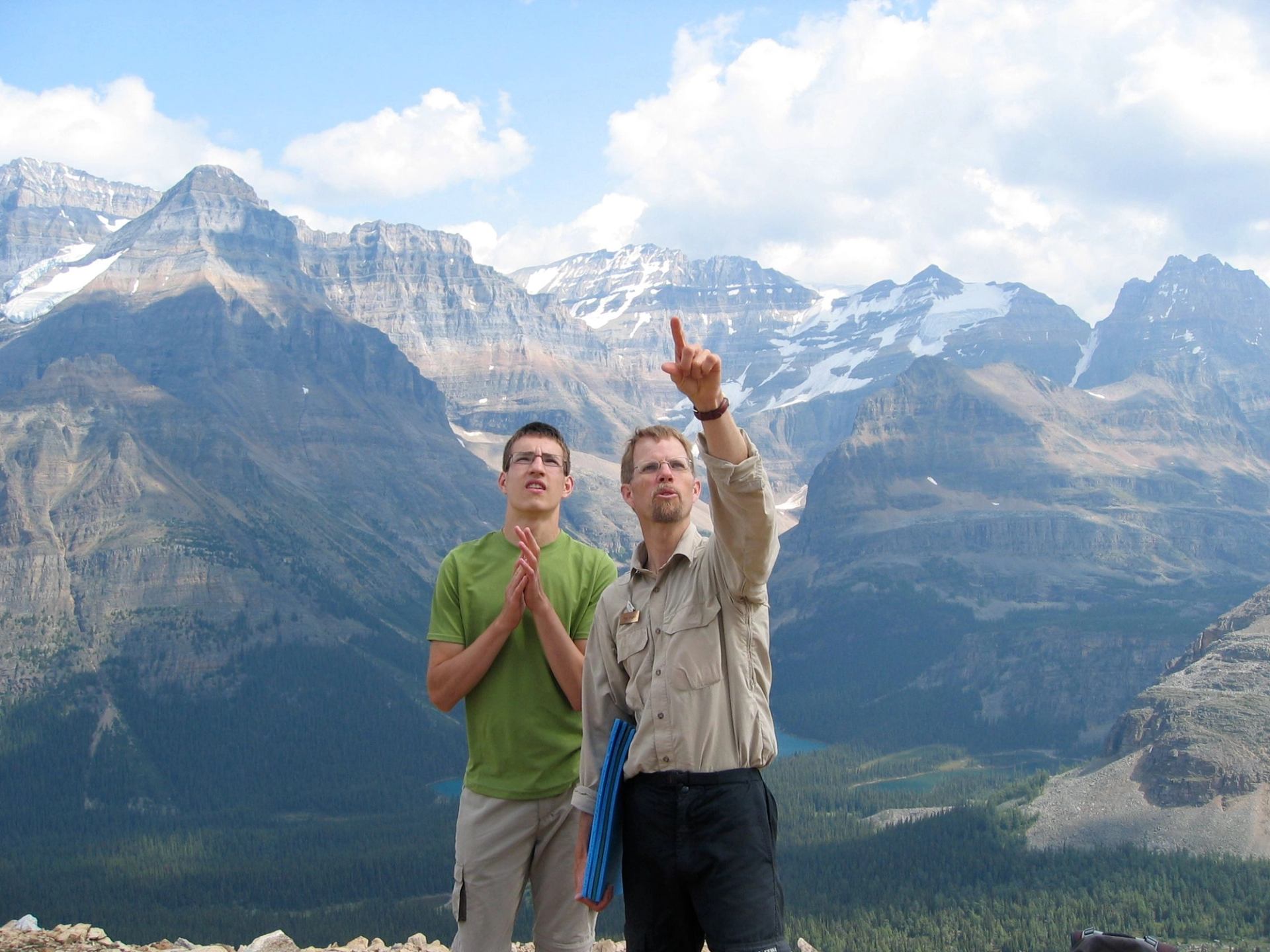 Two people pointing at the Odaray Glacier
