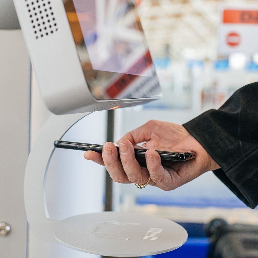 A person scanning their flight pass.