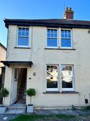 Front side of house displaying sash windows