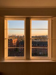 Looking out of sash window at golden hour