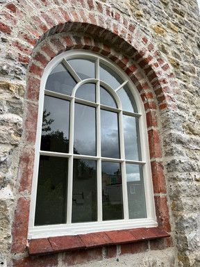 Window surrounded by some lovely brick work