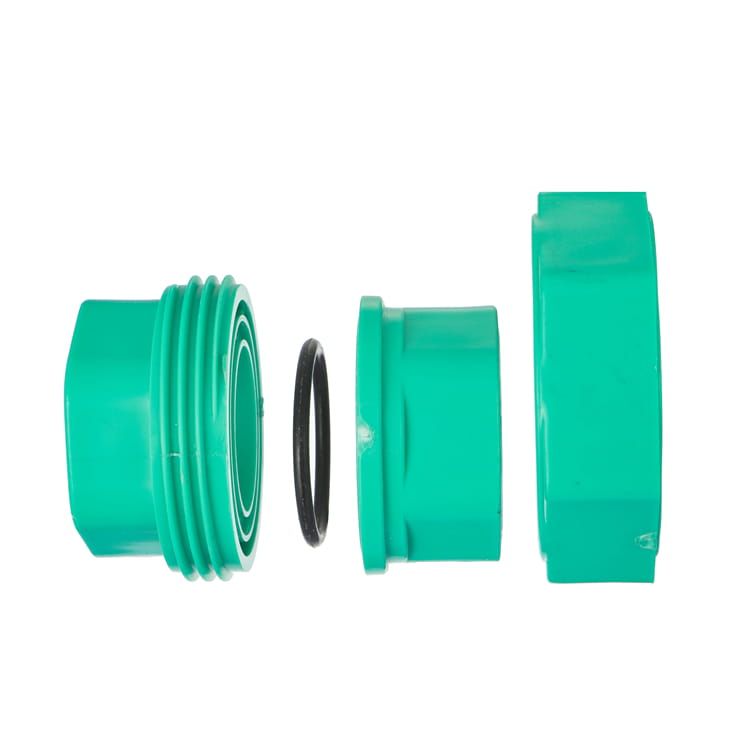 Exploded view of a uPVC union with the black rubber O-ring lifted clear of its seat, showing the groove the ring must sit in and the compression nut that retains it