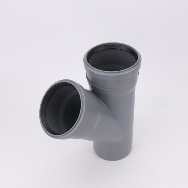 Grey uPVC gasketed branch fitting with a moulded marking on the barrel and a black sealing ring seated in each socket