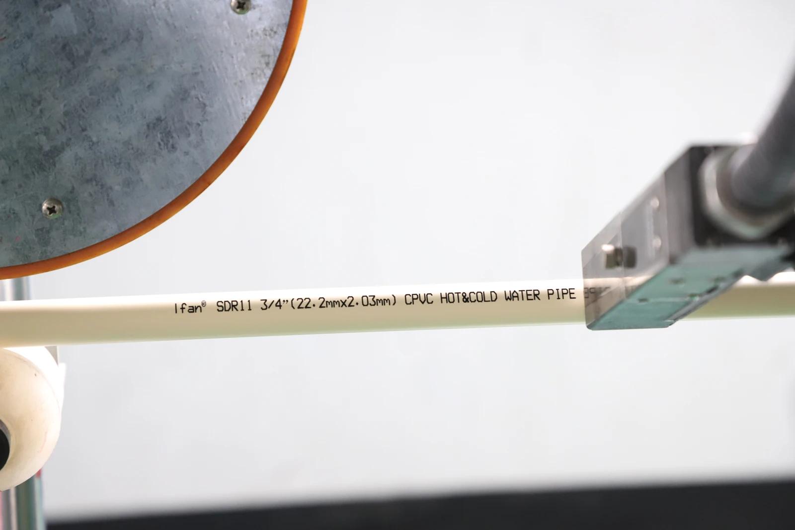 CPVC hot and cold water marking on a pipe at a production machine