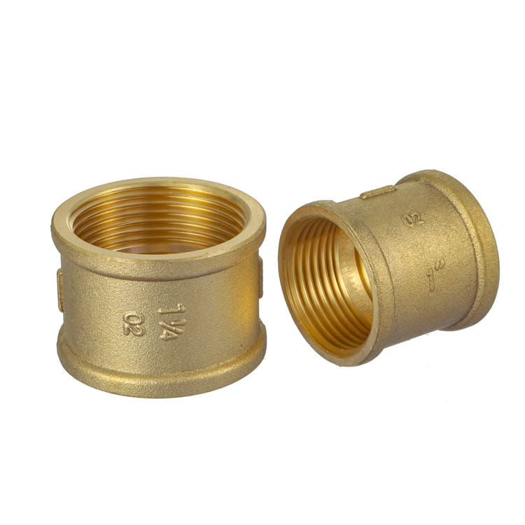 Brass threaded couplings showing internal female threads and cast size marking 1 1/4 on the body
