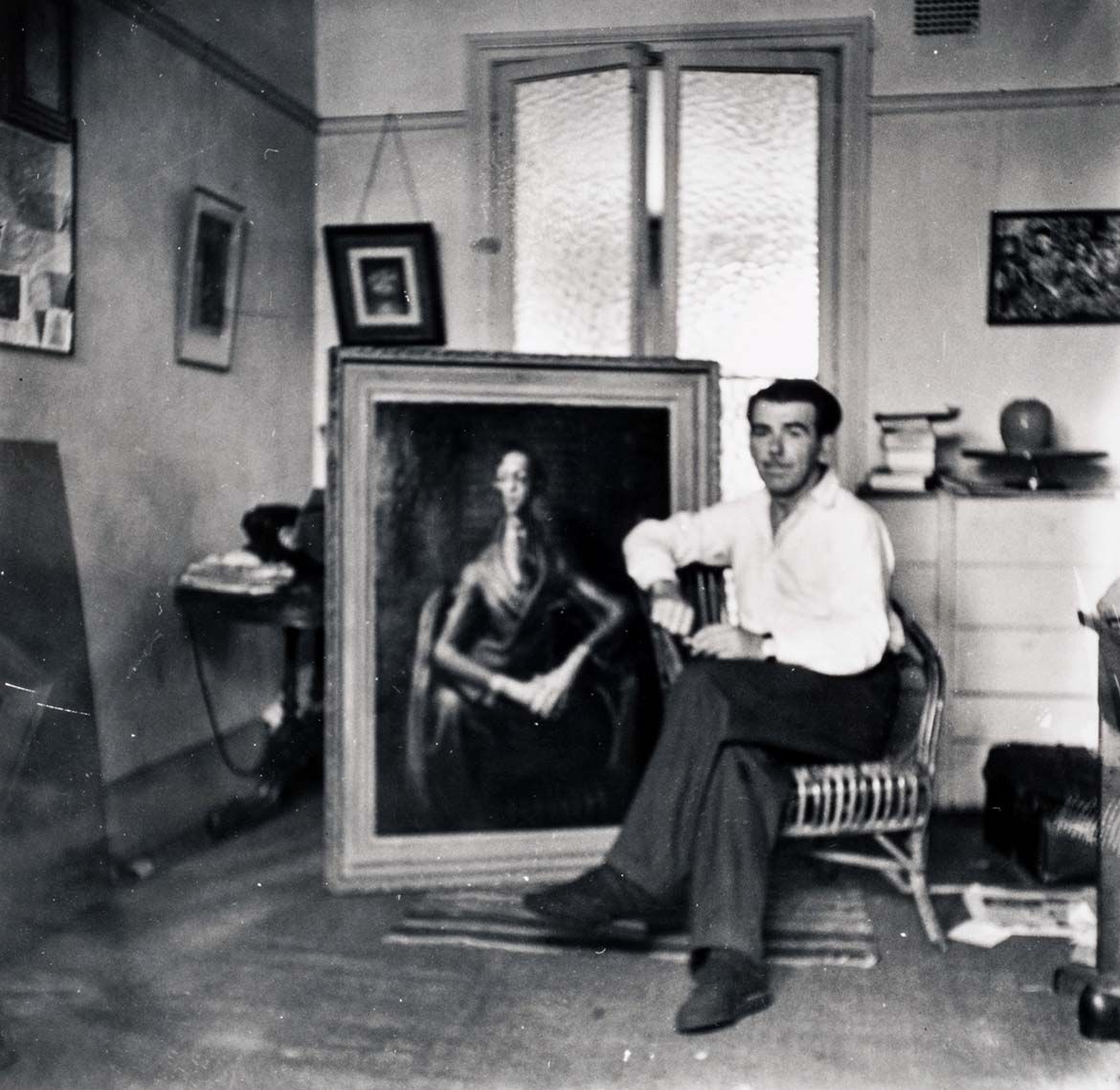 William Dobell in his Studio with Portrait of an artist (Joshua Smith) in 1943 / Photograph courtesy: Betty Churcher / Collection: QAGOMA Research Library
