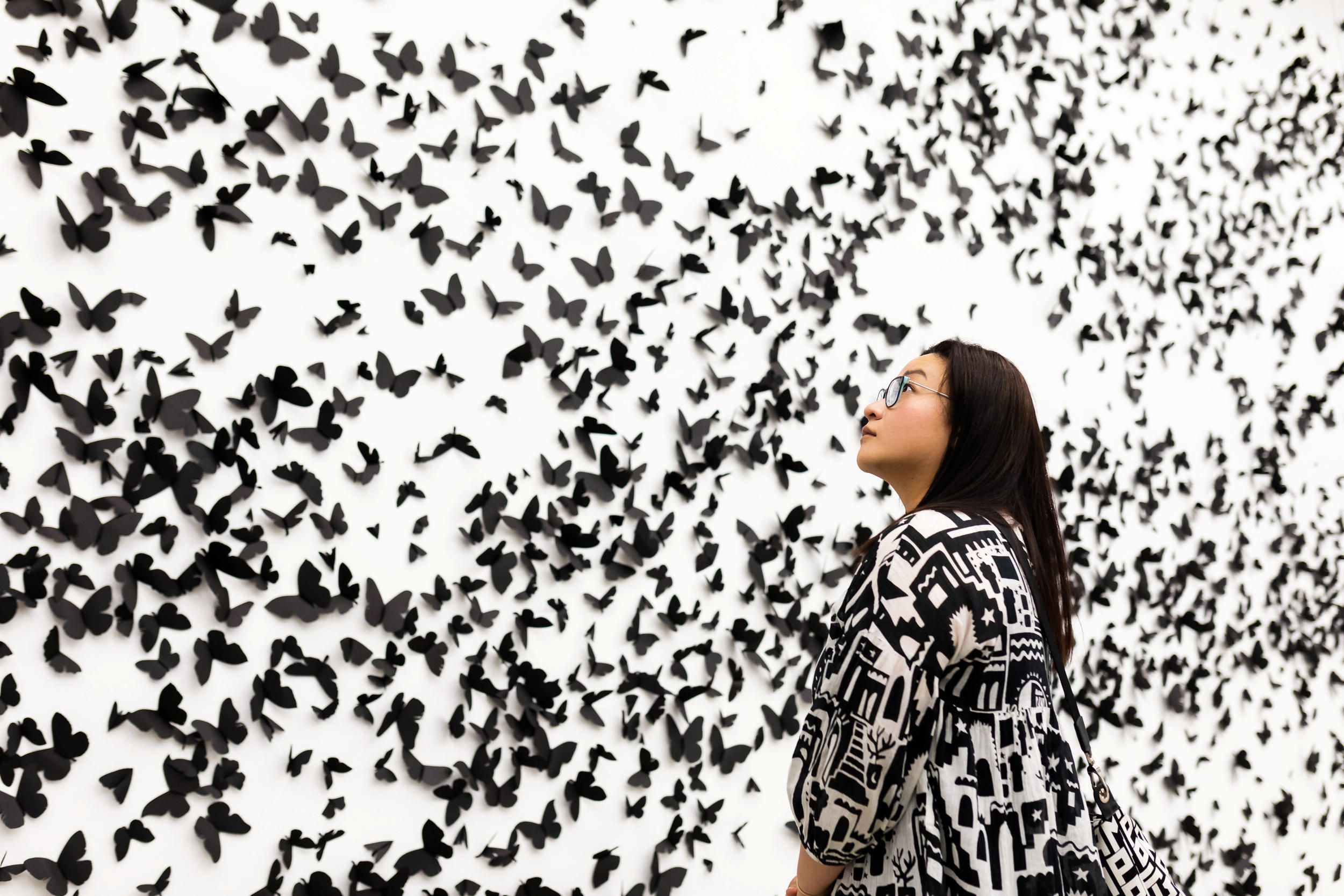 Carlos Amorales / Mexico b.1970 / Black Cloud (installation view) 2007/2018 / 30 000 black laser-cut and handfolded paper butterflies (30 different butterfly and moth species in five sizes with a wave wing pattern), ed. 1/3 (+ 1 A.P.) / dimensions variable / Purchased 2022 with funds from Tim Fairfax AC through the Queensland Art Gallery | Gallery of Modern Art Foundation / Images courtesy: kurimanzutto, Mexico City