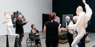 An Auslan interpreter accompanies the volunteer guide on tours for Deaf visitors