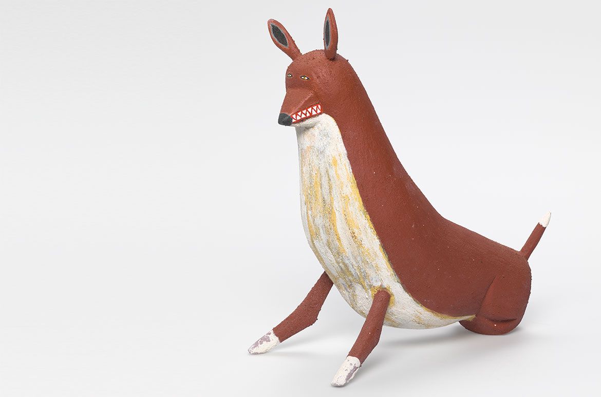 David Marpoondin, Wik-Ngathan/Wik-Me'an people, Australia b.1968 / Ku' (Camp dog) 2010 / Carved milkwood (Alstonia muellerana) with natural pigments, charcoal, synthetic polymer paint and acrylic binder / 33 x 33 x 15cm / Purchased 2010 with funds from the Josephine Ulrick and Win Schubert Diversity Foundation through the QAG Foundation / Collection: Queensland Art Gallery | Gallery of Modern Art / © David Marpoondin