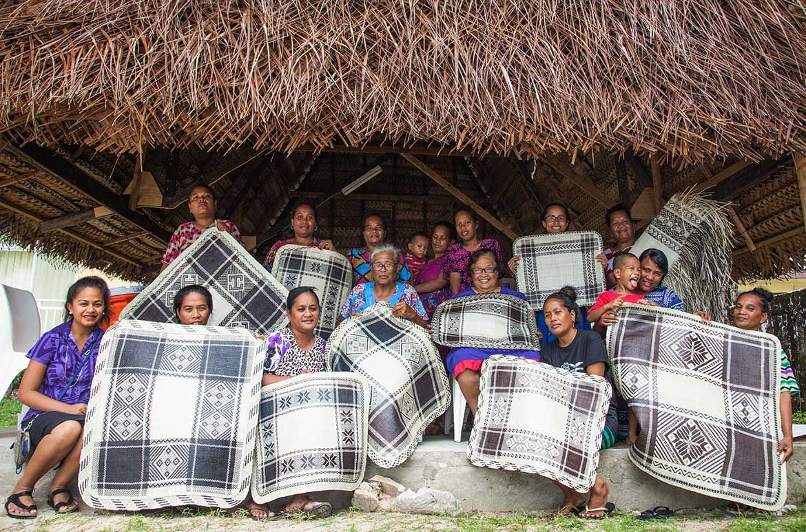 Participants in the Jaki-ed weaving workshop; from back left: Susanta Jieta, Rosie Elmorey, Clantine Moladrik, Roselee Jibon, Moje Kelen, Kathy Jetñil-Kijiner, Susan Jieta, Terse Timothy and Mela Kattil, Aileen Sefiti, Motdrik Paul, Banithe Jesse, Artina Clarence, Helmera Fandino and Airine Keju / Photograph: Chewy Lin / Image courtesy: Photographers and University of the South Pacific Majuro Campus