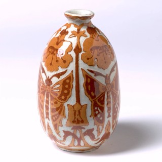 LJ Harvey, Australia 1871-1949 / Vase 1928 / Earthenware, slip-cast body and decorated in the double scraffito technique with rust and ochre clays with four panels of butterflies and alamandas / 11 x 6.5cm (diam) / Gift of friends and students of LJ Harvey 1938 / Collection: Queensland Art Gallery | Gallery of Modern Art
