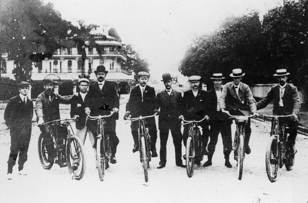 David Spencer (standing fifth from the right in a bowler hat) with fellow members of the Queensland Motor Cycle Club outside Parliament House with the Bellevue Hotel George Street, Brisbane in the background / Queensland Motor Cyclists’ The Brisbane Courier (Qld: 1864-1933) 19 January 1907 http://nla.gov.au/nla.news-article19504334 and Image ‘On Winged Wheels’ The Brisbane Courier (Qld: 1864-1933) 19 January 1907 http://nla.gov.au/nla.news-article19504335.