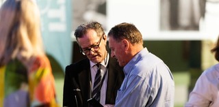 A GVSO greeting visitors to a major exhibition at GOMA
