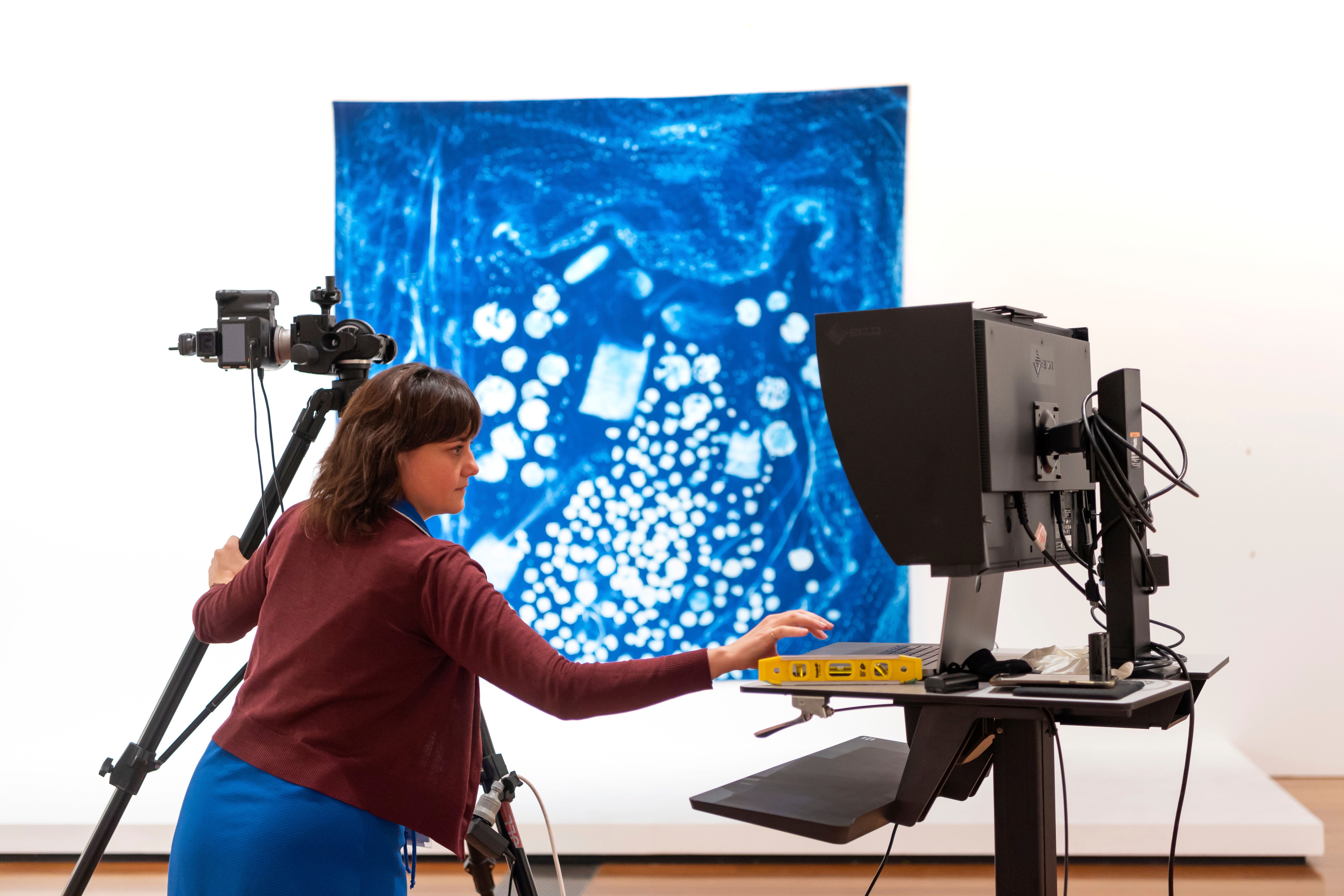 A QAGOMA staff member digitises Quandamooka djagan marimba (Quandamooka Country is beautiful) 2020 by Sonja Carmichael (Ngugi people of Quandamooka, Minjerribah (North Stradbroke Island)) and Elisa Jane Carmichael (Ngugi people) / Purchased 2021. Queensland Art Gallery | Gallery of Modern Art Foundation / GOMA, July 2022 / Photograph: L Wilkes © QAGOMA