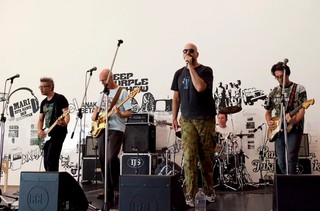 Amid an installation by Indonesian art collective ruangrupa, The Family Butchers perform a tribute to The Kuda, at the opening weekend of ‘The 7th Asia Pacific Triennial of Contemporary Art’, December 2012 / Photograph: C Callistemon © QAGOMA