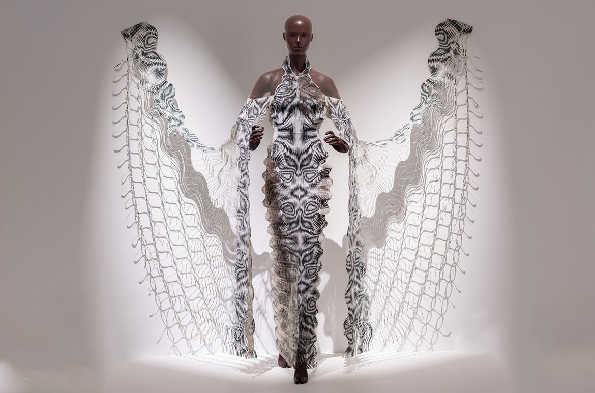 Iris van Herpen, Netherlands b.1984 / Philip Beesley (Collaborator), Canada b.1956 / Hypnosis cape-dress, from the ‘Hypnosis’ collection 2019 / Laser-cut duchesse satin, mylar, tulle / © & courtesy: Iris van Herpen atelier / Photograph: N Umek © QAGOMA