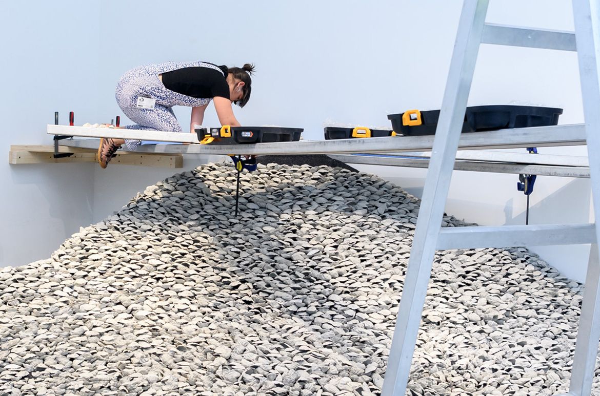 Megan Cope, Quandamooka people, Australia b.1982 / RE FORMATION 2019 / 12 000 pieces of cast-concrete, ilmenite / Purchased 2019 with funds from the Contemporary Patrons through the Queensland Art Gallery | Gallery of Modern Art Foundation / Collection: Queensland Art Gallery | Gallery of Modern Art / © Megan Cope