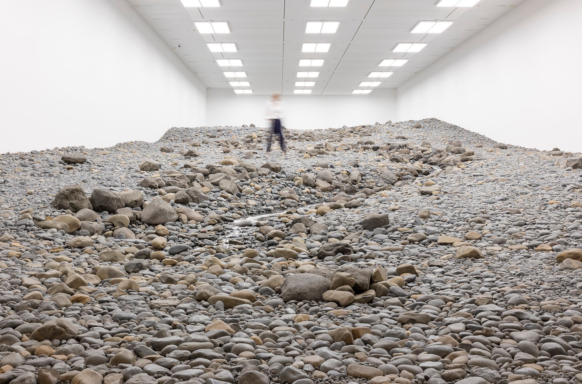 Olafur Eliasson, Denmark b.1967 / Riverbed 2014 / Water, rock (volcanic stones [blue basalt, basalt, lava], other stones, gravel, sand), wood, steel, plastic sheeting, hose, pumps / Purchased 2021. The Josephine Ulrick and Win Schubert Charitable Trust / Collection: The Josephine Ulrick and Win Schubert Charitable Trust, QAGOMA / © 2014 Olafur Eliasson / Photograph: K Bennett © QAGOMA