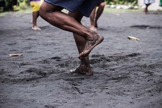 Dancing on black ash ground of Emyotungan village, Ambrym, 2014 / Photograph courtesy of Sarah Doyle, Further Arts, Port Vila
