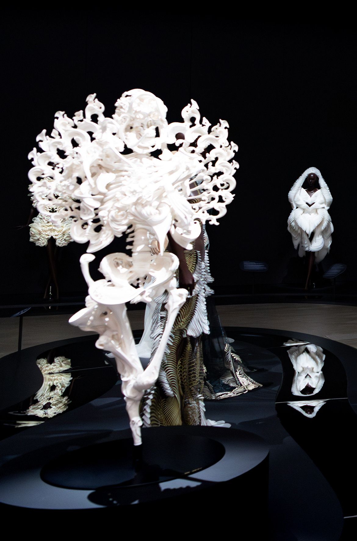 Installation view ‘Iris van Herpen: Sculpting the Senses’, GOMA 2024 featuring Yomotsuōkami 2023 by Heishiro Ishino / Iron, stone powder clay, lacquer, resin, acrylic paint / © Heishiro Ishino / Photograph: C Callistemon © QAGOMA
