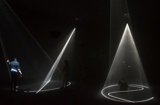 Anthony McCall, United Kingdom/United States b.1946 / Installation view of Crossing 2016 / Two double video projections (16 minutes), haze machine and sound / Commissioned to mark the tenth anniversary of the opening of the Gallery of Modern Art. Purchased 2016 with funds from Tim Fairfax AC through the Queensland Art Gallery | Gallery of Modern Art Foundation / Collection: Queensland Art Gallery | Gallery of Modern Art / © Anthony McCall