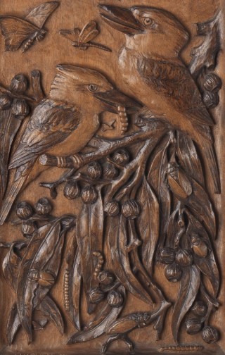 LJ Harvey, Australia 1871-1949 / (Screen with kookaburras and landscape) 1931 / Carved Queensland beech panel with supports in silky oak / 108.5 x 42.8 x 30.5cm / Purchased 1988 with the assistance of the Reverends David and Bruce Noble / Collection: Queensland Art Gallery | Gallery of Modern Art