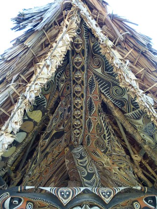 Simon Goiyap | b.1973 | Kwoma people, Mino village, East Sepik River, Papua New Guinea | Koromb (Spirit house) | Natural pigments on pangal and carved garamut with sago leaf thatching