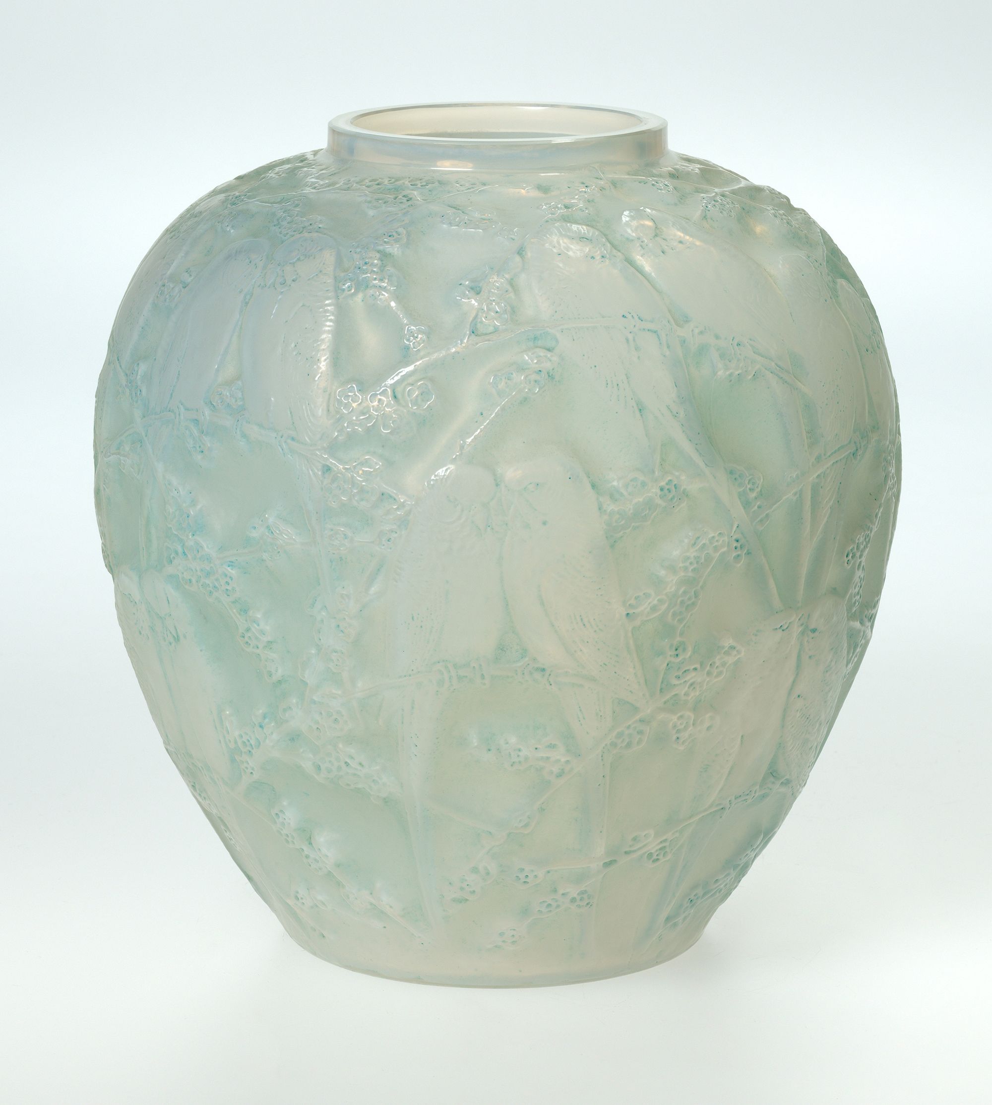 René Lalique, France 1860-1945 / Perruches (Parakeet) vase designed 1919 / Mould blown blue opalescent and frosted glass with grey patina / 25 x 24 x 24cm / Purchased 2018. QAGOMA Foundation / Collection: Queensland Art Gallery | Gallery of Modern Art