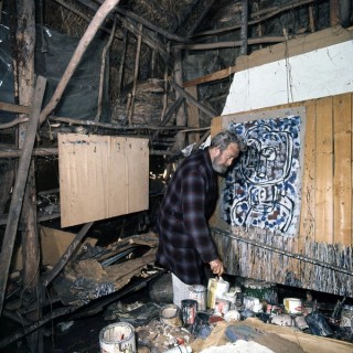 Ian Fairweather painting in his studio on Bribie Island, 1972 /  A6135, K24/11/72/1 / Courtesy: National Archives of Australia