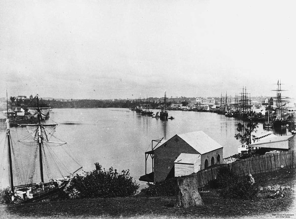 Sailing ships moored in the Brisbane River at Petrie Bight, overlooking the buildings at the Brisbane Wharves and the Kangaroo Point cliffs, 1875 / Courtesy: John Oxley Library, State Library of Queensland